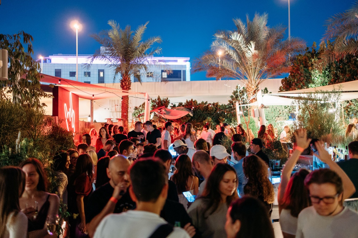 Outdoor evening party under the palms in Dubai